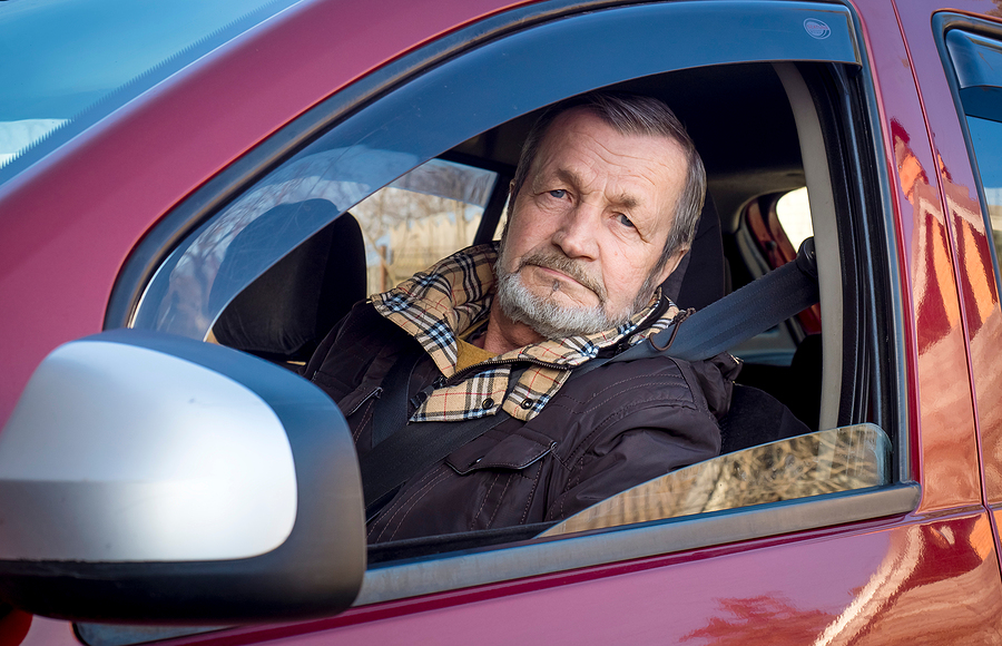 An elderly man getting a driving evaluation for seniors