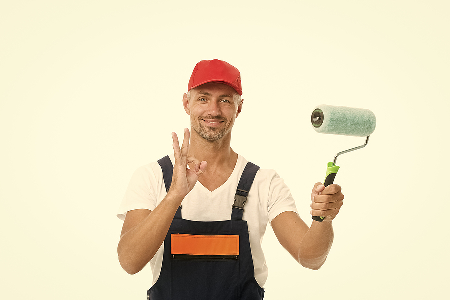 Male worker offering professional Melbourne painting services